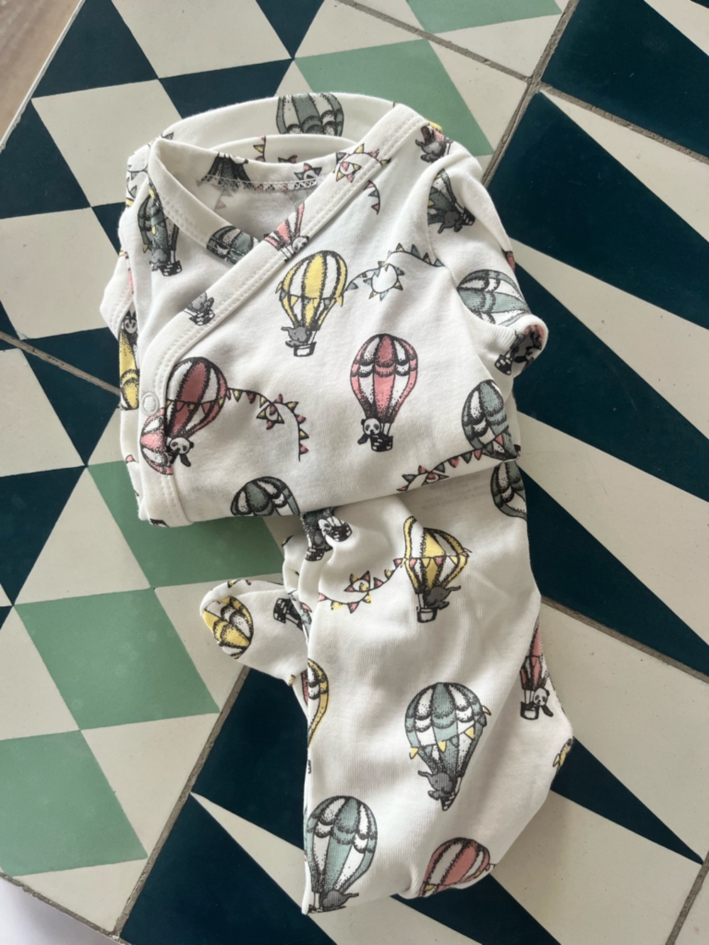 H&M White Baby Onesie with Pink, Yellow and Gray Hot Air Balloon Print